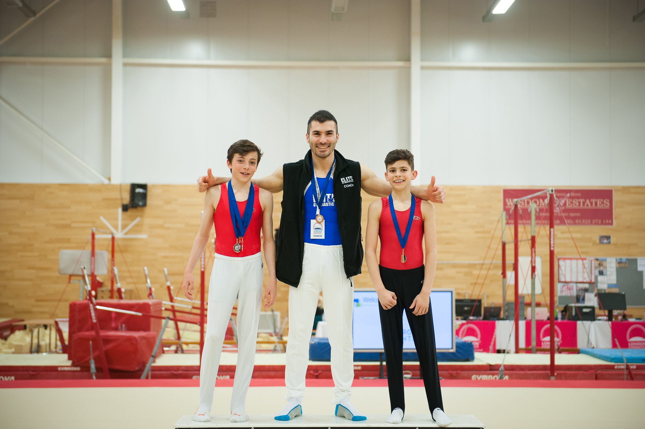 coach Stef and his gymnasts from the Elite G.A. after the event