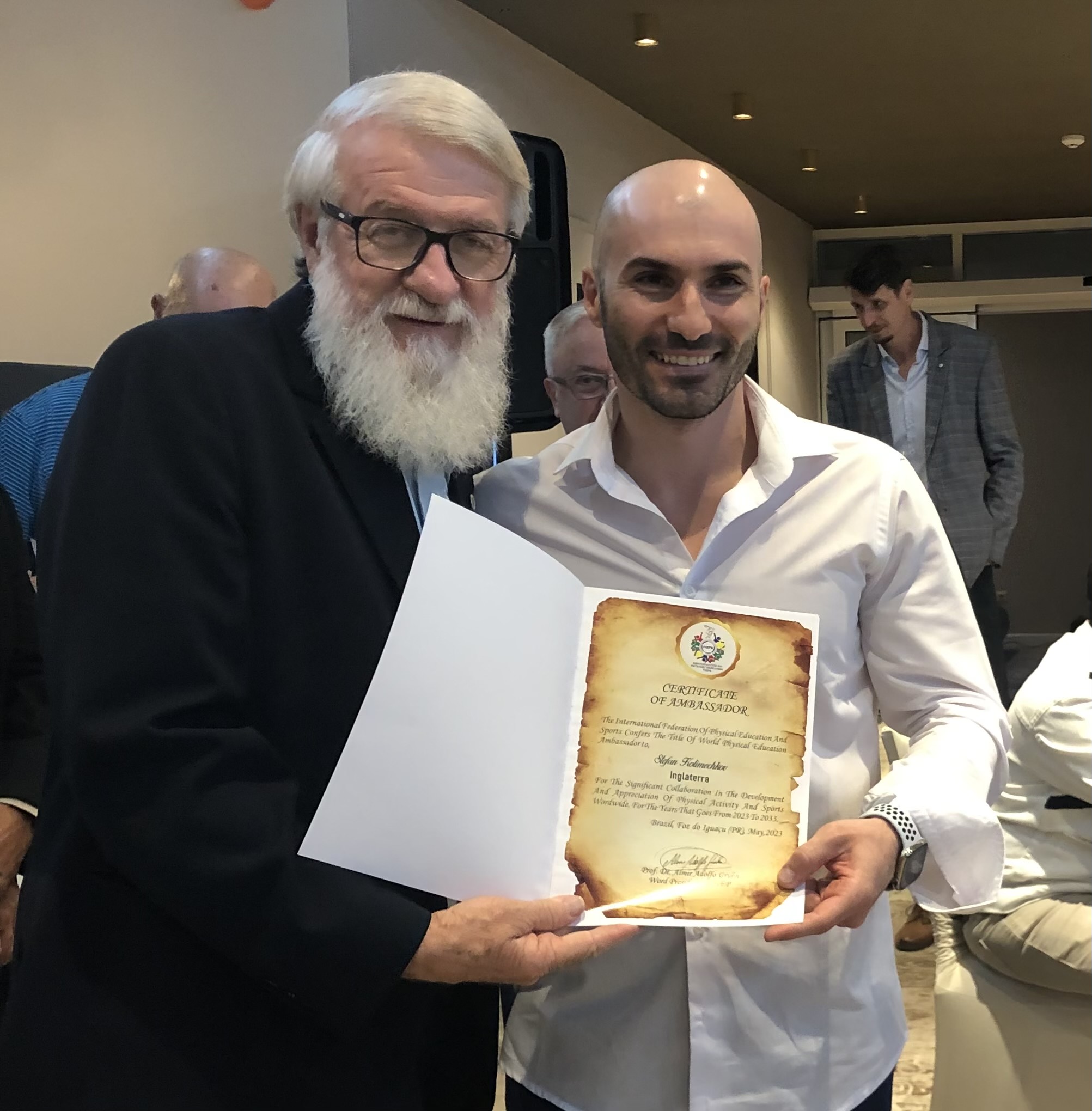 Dr Stefan Kolimechkov was awarded the World Physical Education Ambassador by Professor Almir GRUHN FIEPS World