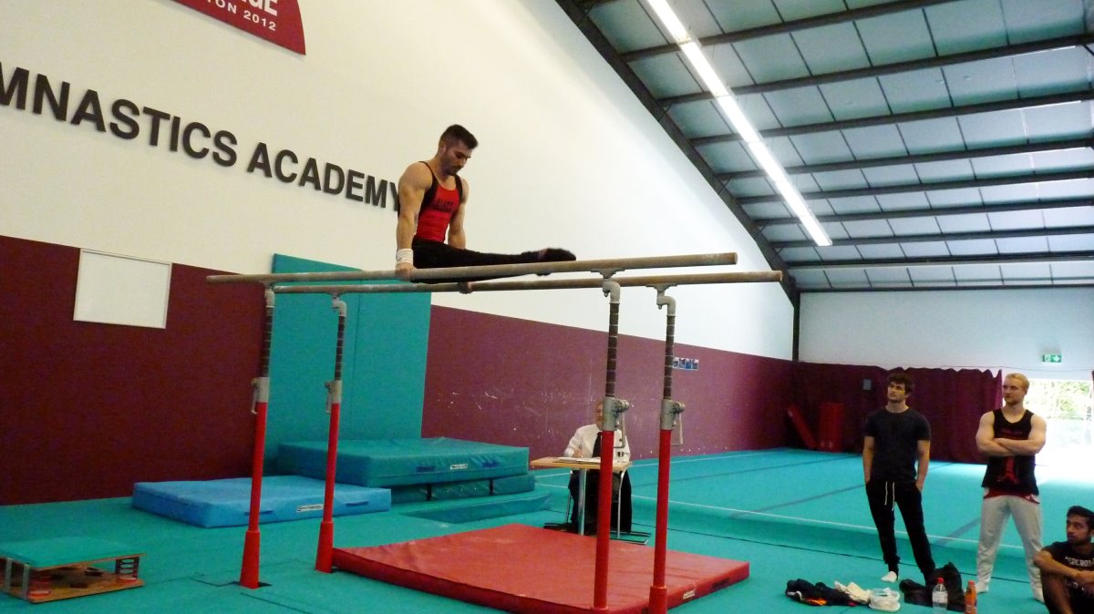 Stefan on Parallel Bars at Sutton Gymnastics Academy